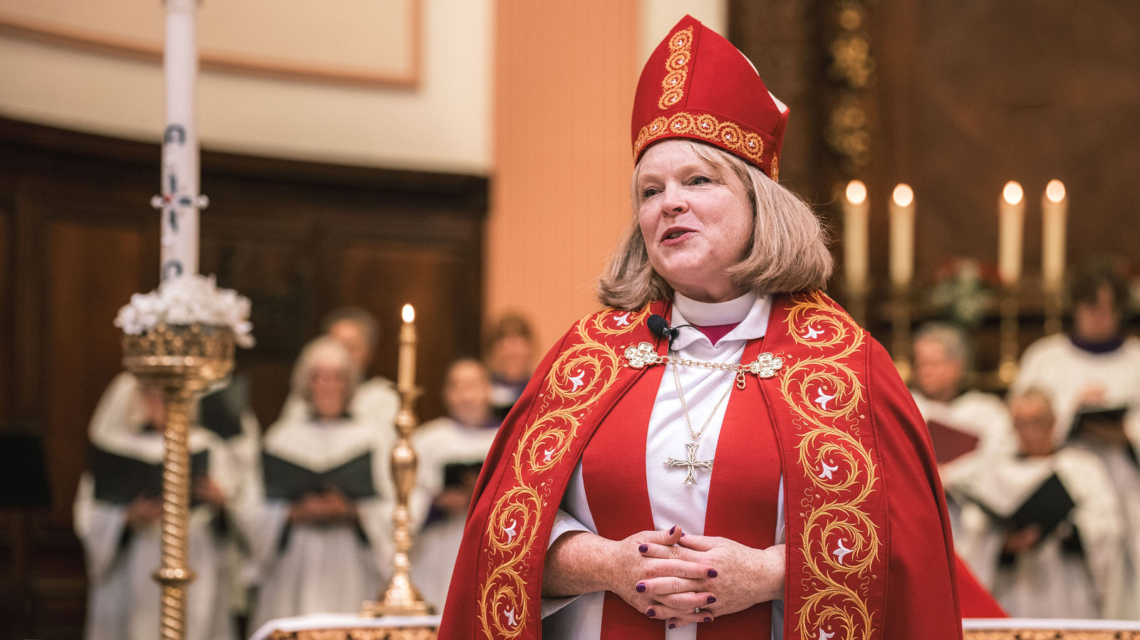 The congregation stands in support of the new deacons