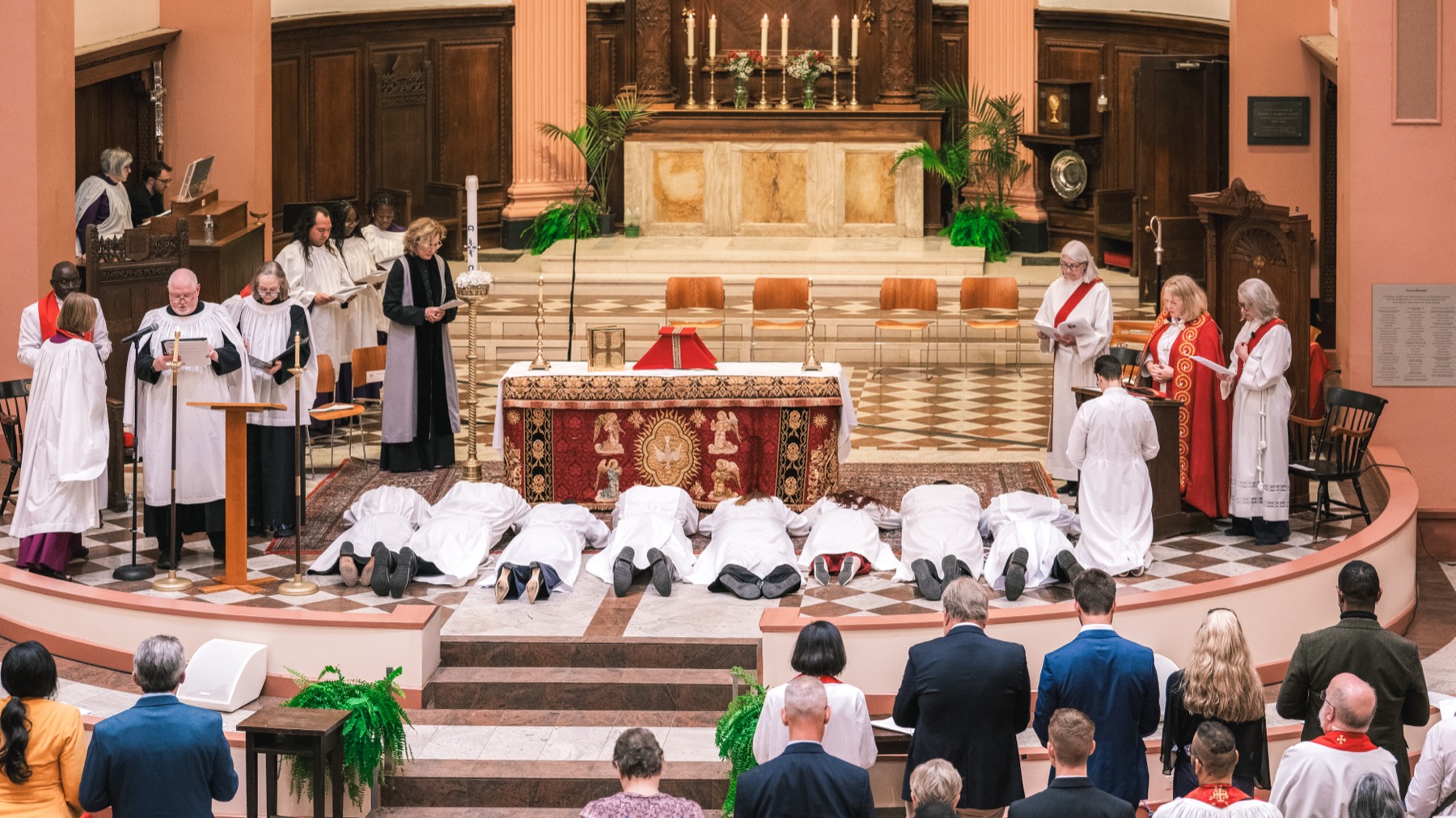The ordinands lie prostrate and kneel during the litany of prayer