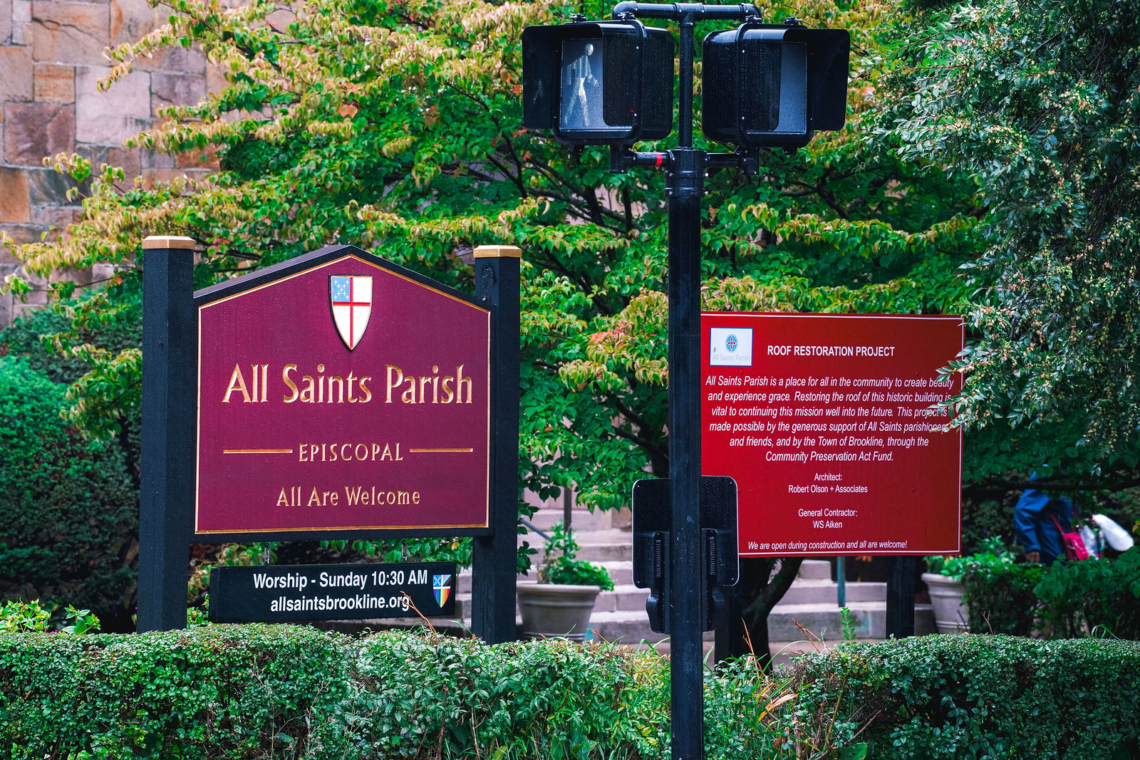 All Saints Parish and roof restoration project signs in Brookline