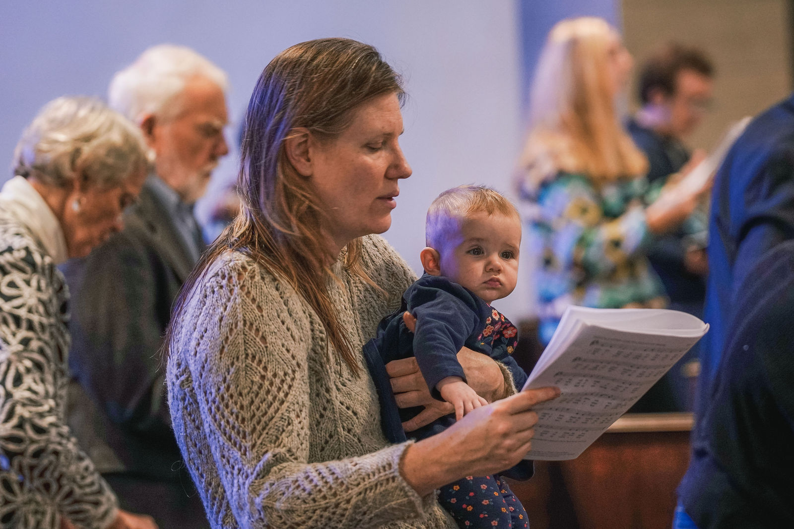 Congregants worshiping at All Saints Parish in Brookline