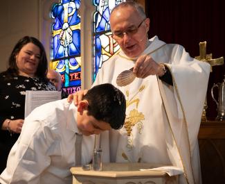 Baptism of young person at St. Luke's-San Lucas, Chelsea, MA