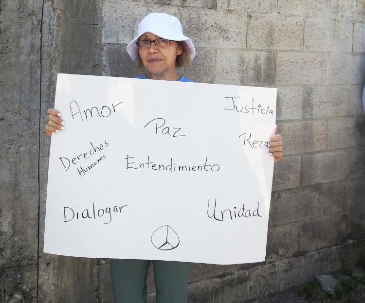 Vivian Ruiz with justice march sign