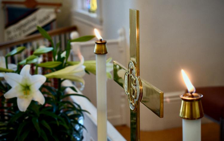 Easter lilies with cross and candles