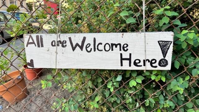 "All are Welcome Here!" sign at Emmanuel House in Allston