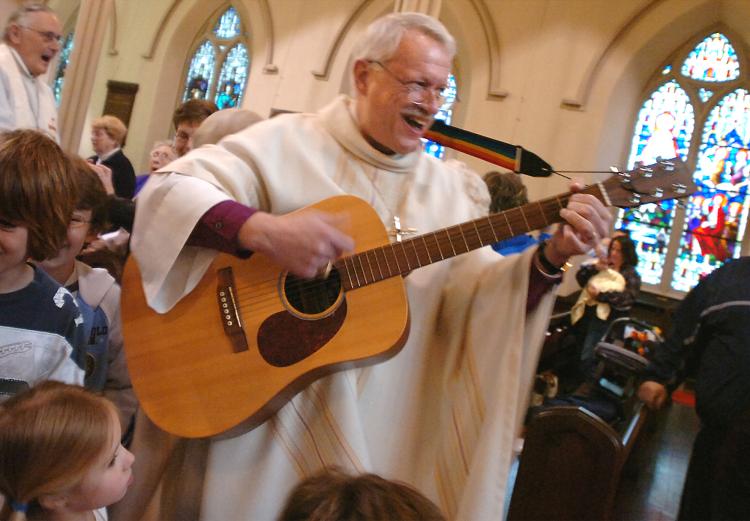 Bishop Bud Cederholm with guitar